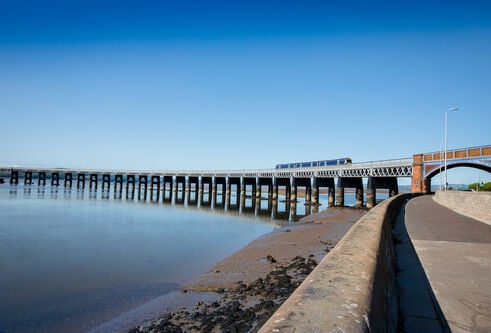 the tay rail bridge and a blue sky