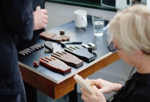 a table with wooden hands on it