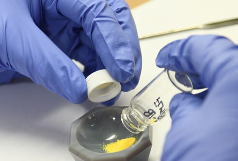 Scientist removes drugs from storage capsule