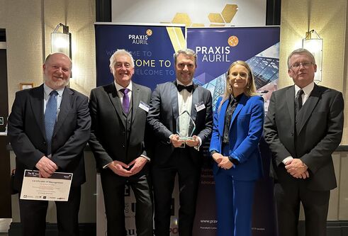 Members of CeTPD and RIS stand with their award