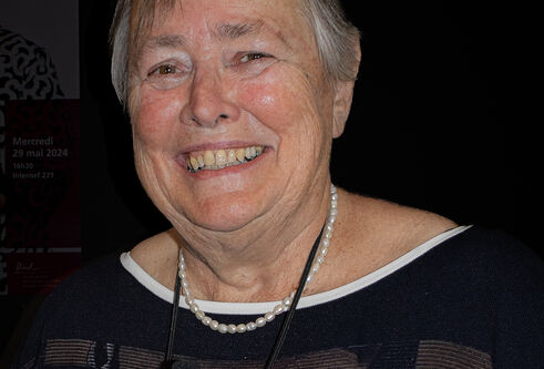 Dr Sheila Willis, former Director General of Forensic Science Ireland, smiling in front of a black background