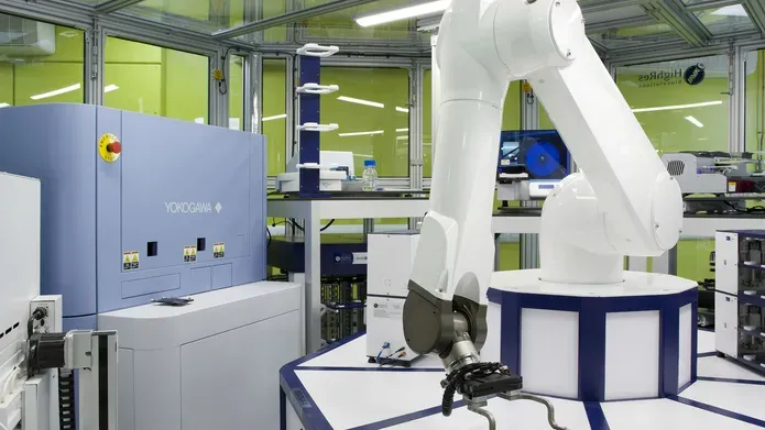 Picture of robot and microscope used in male fertility research