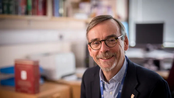Professor Bob Steele sits in his office