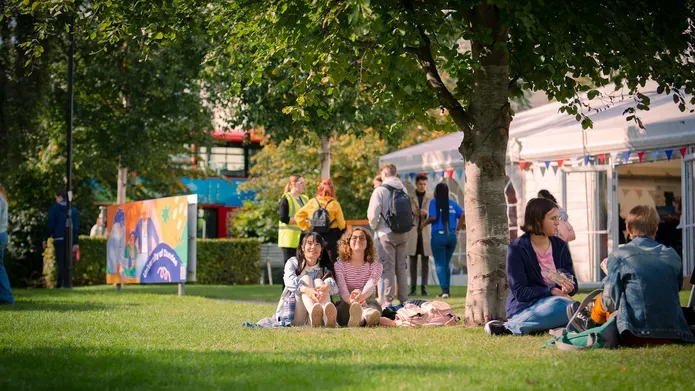 Students sitting on Campus Green