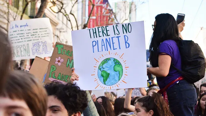 Crowd of environmental protestors, placard with words 'There is no plan B'