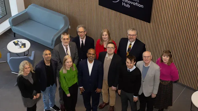 An overview shot of representatives of Chemveda, the University of Dundee, Dundee City Council and Scottish Development International inside the Innovation Hub. 
