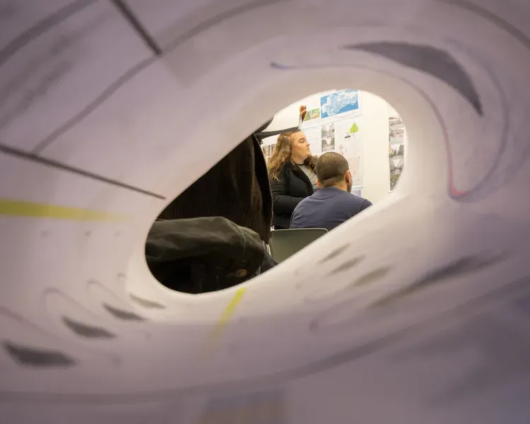 Looking through a huge roll of paper