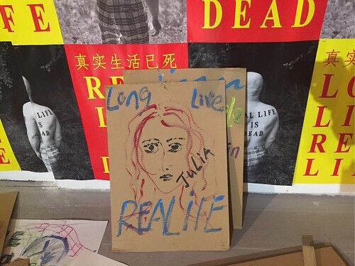 brown book cover with long live real life on it