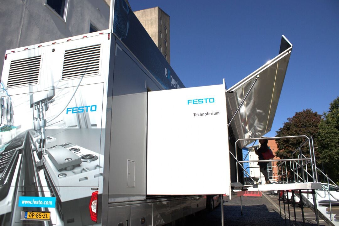 The side of the Technoferium - the trailer/expo space, with the side of the steps leading up to the entrance and an external platform.